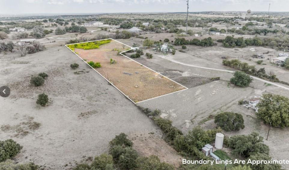 314 Windy Hill Lane Springtown, TX 76082 - Photo 10 of 15 Aerial view of sparsely populated area featuring property boundaries highlighted and a desert landscape