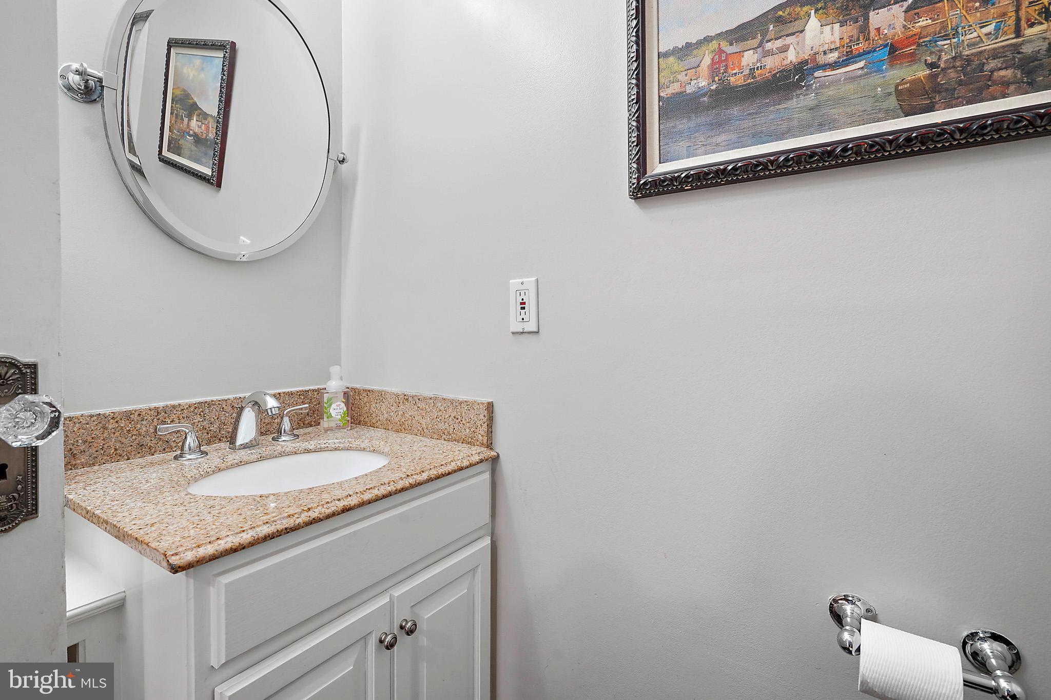 1503 Russell Road Alexandria, VA 22301 - Photo 15 of 39 a bathroom with a granite countertop sink and a mirror