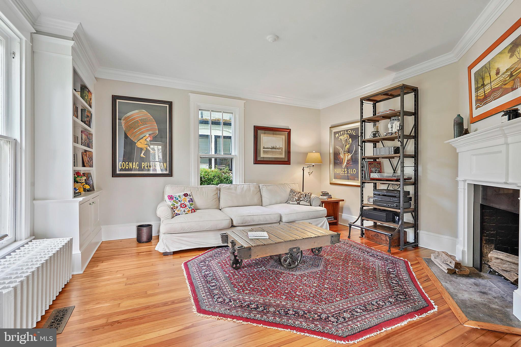 1503 Russell Road Alexandria, VA 22301 - Photo 18 of 39 a living room with furniture a rug and a fireplace