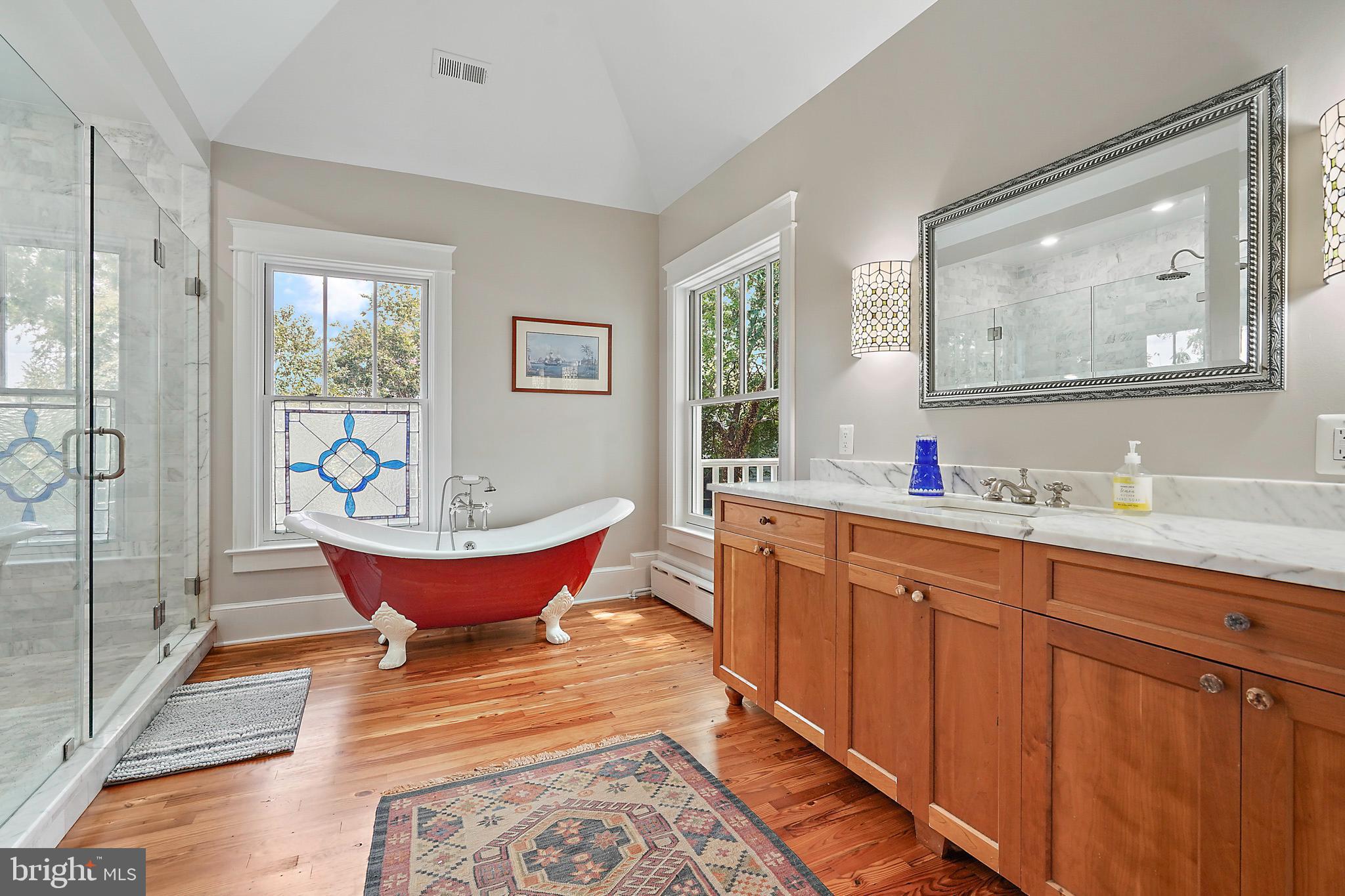 1503 Russell Road Alexandria, VA 22301 - Photo 24 of 39 a spacious bathroom with a granite countertop tub sink and window