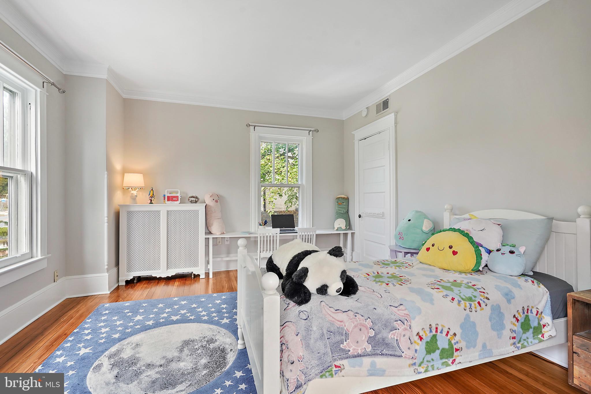 1503 Russell Road Alexandria, VA 22301 - Photo 26 of 39 a bedroom with a bed and wooden floor