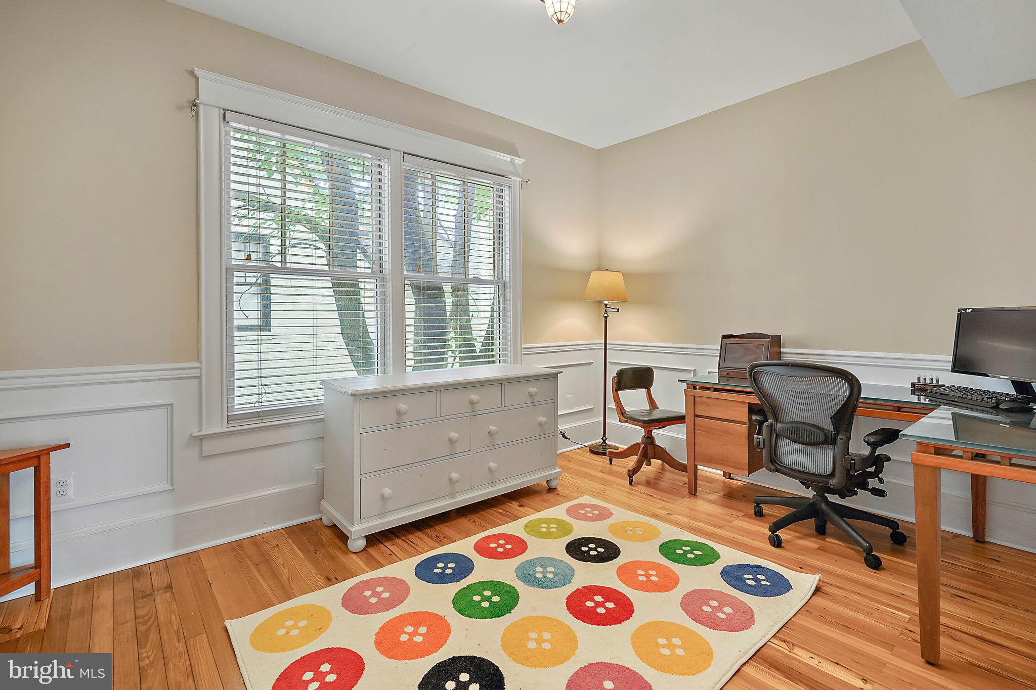 1503 Russell Road Alexandria, VA 22301 - Photo 29 of 39 a bedroom with a bed and wooden floor