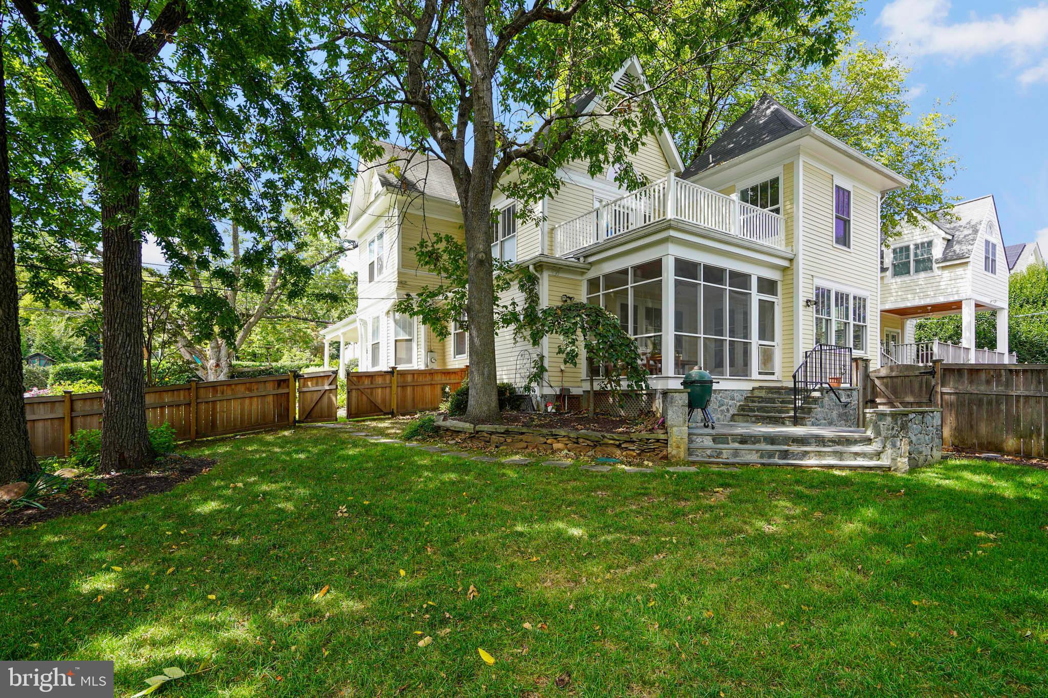 1503 Russell Road Alexandria, VA 22301 - Photo 4 of 39 a front view of a house with backyard and sitting area