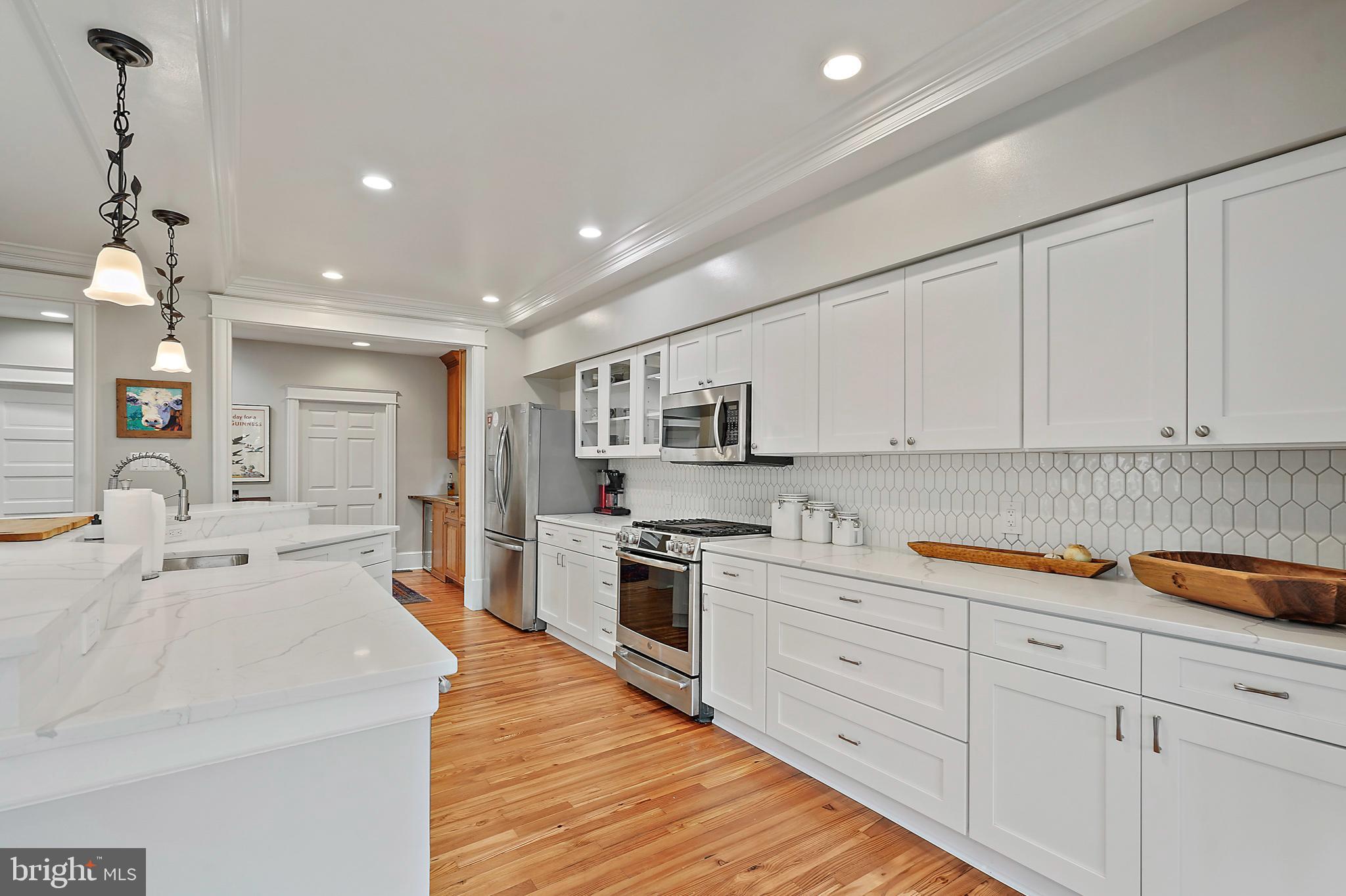 1503 Russell Road Alexandria, VA 22301 - Photo 9 of 39 a large kitchen with stainless steel appliances lots of counter space sink and cabinets