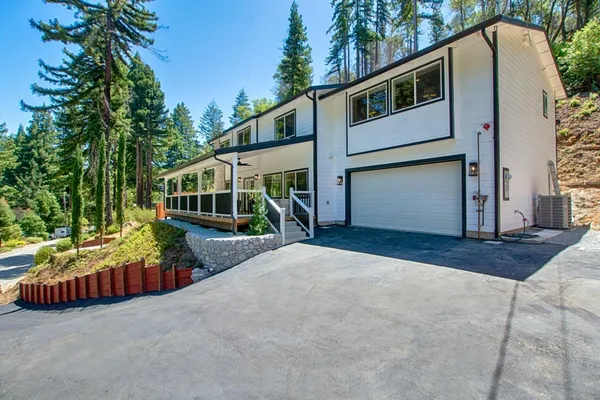 a house with trees in the background