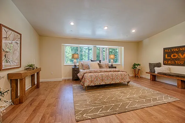 a bathroom with double vanity sinks and a mirror