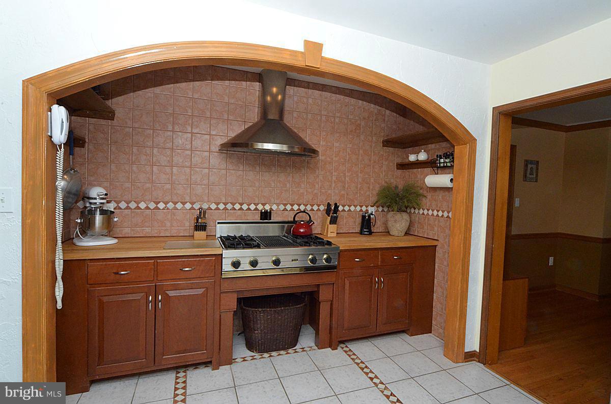 7900 Bennett Branch Road Mount Airy, MD 21771 - Photo 2 of 30 a kitchen with a stove and a cabinets