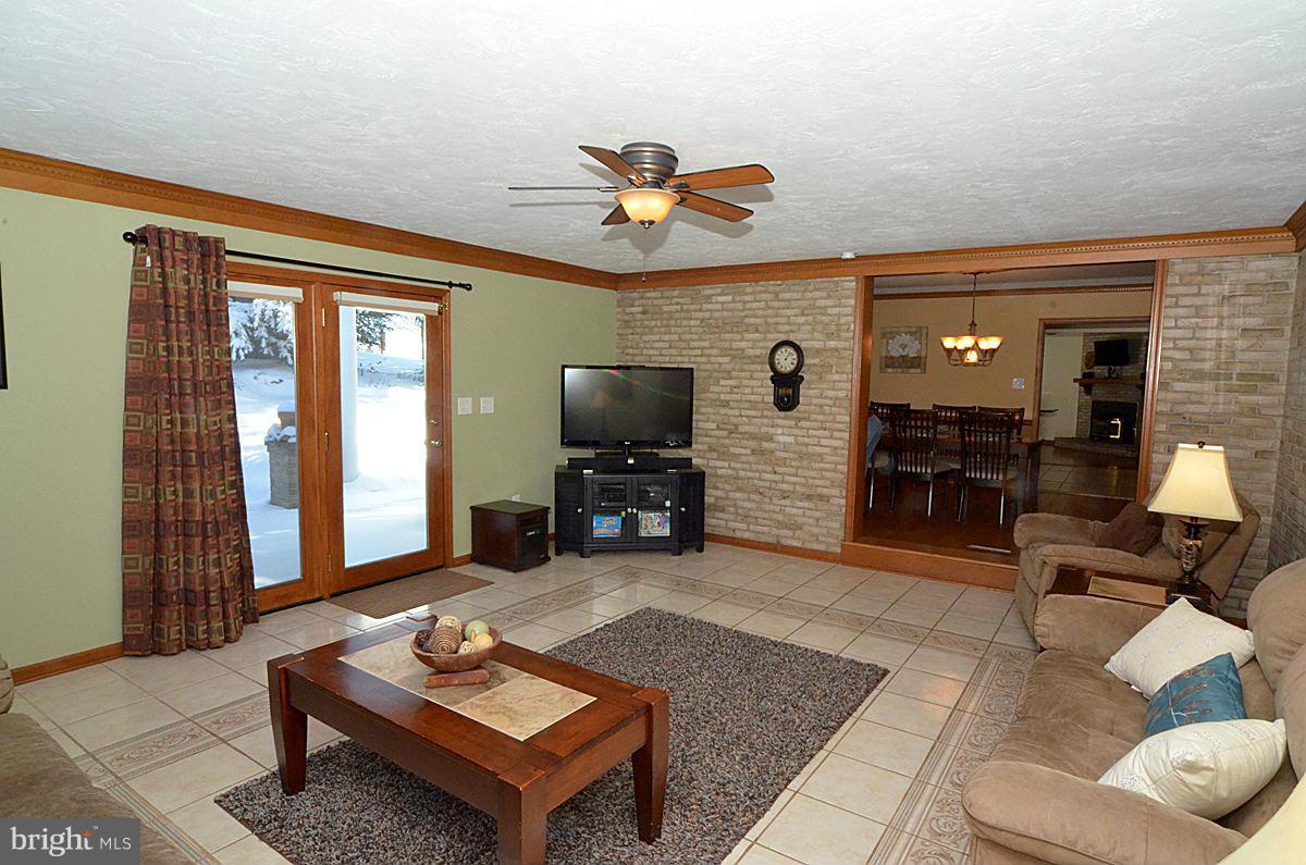 7900 Bennett Branch Road Mount Airy, MD 21771 - Photo 13 of 30 a living room with furniture and a flat screen tv