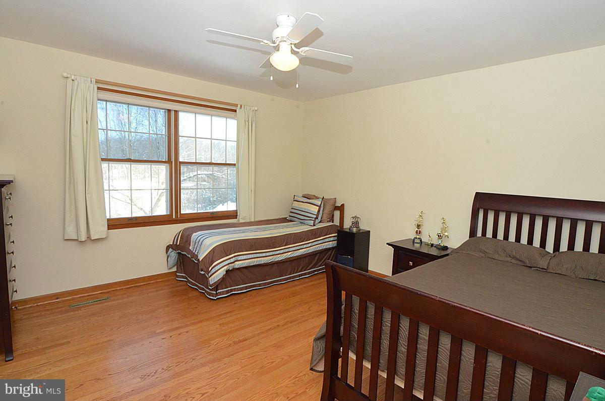 7900 Bennett Branch Road Mount Airy, MD 21771 - Photo 19 of 30 a bedroom with two beds and a window