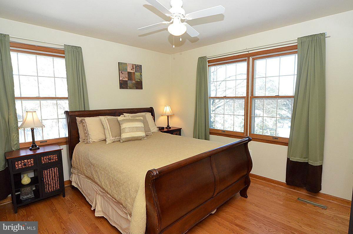 7900 Bennett Branch Road Mount Airy, MD 21771 - Photo 20 of 30 a bed sitting in a bedroom next to a window