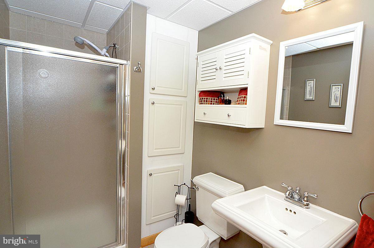 7900 Bennett Branch Road Mount Airy, MD 21771 - Photo 24 of 30 a bathroom with a sink mirror and toilet