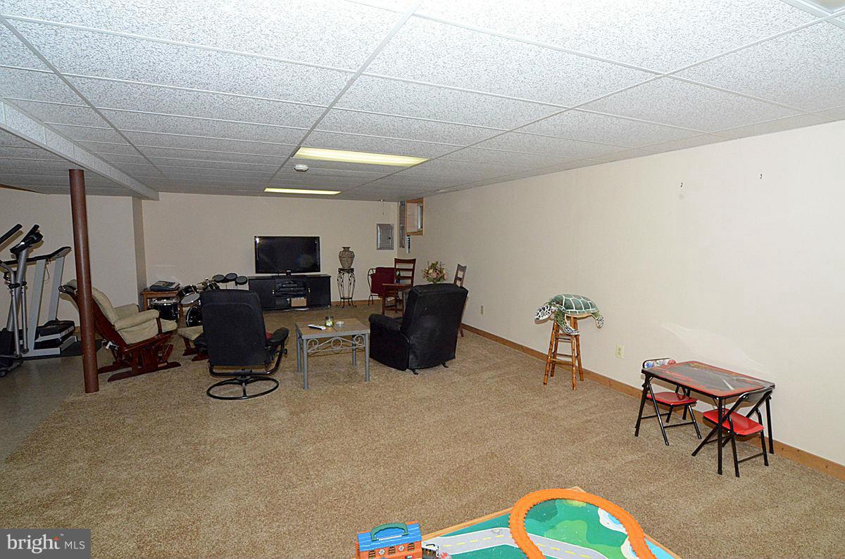 7900 Bennett Branch Road Mount Airy, MD 21771 - Photo 27 of 30 a room with furniture a air conditioner and a window