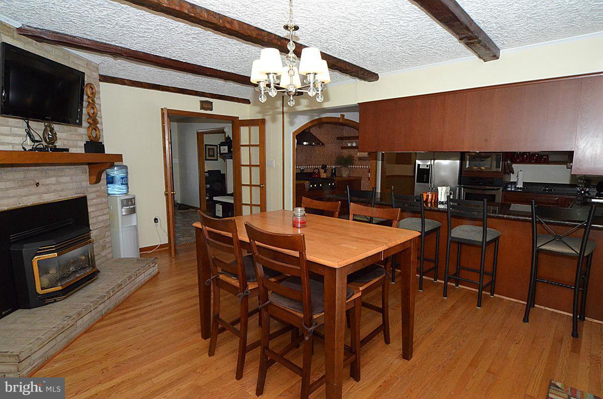 7900 Bennett Branch Road Mount Airy, MD 21771 - Photo 6 of 30 a view of a dining room with furniture and wooden floor