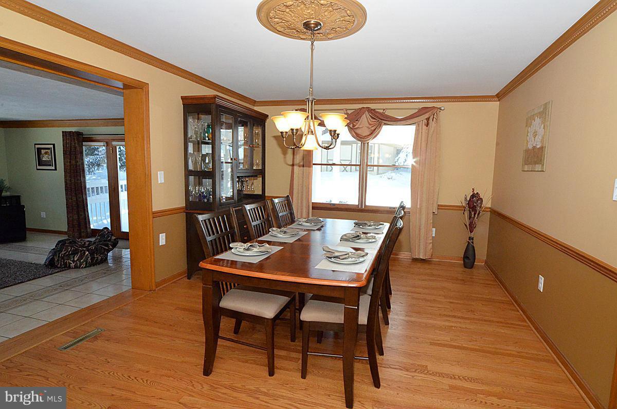 7900 Bennett Branch Road Mount Airy, MD 21771 - Photo 7 of 30 a view of a dining room with furniture window and wooden floor