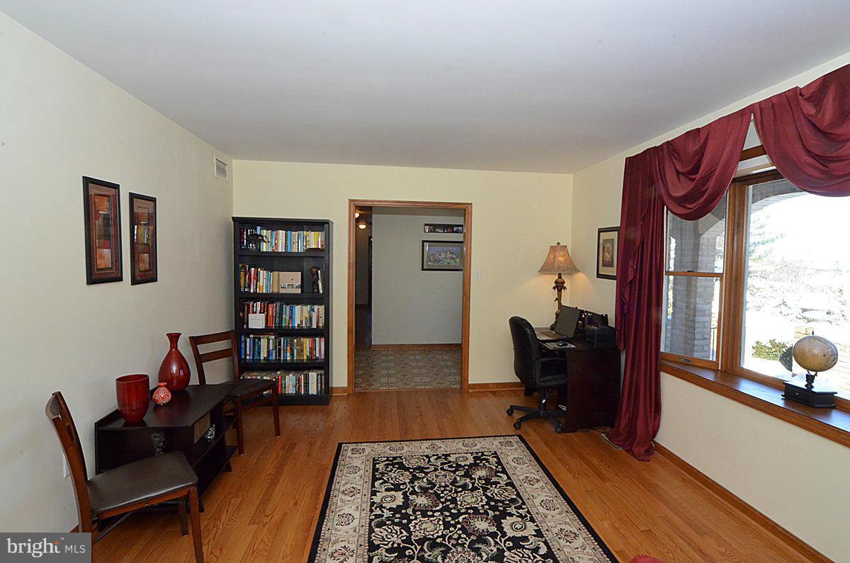7900 Bennett Branch Road Mount Airy, MD 21771 - Photo 10 of 30 a living room with furniture and a rug