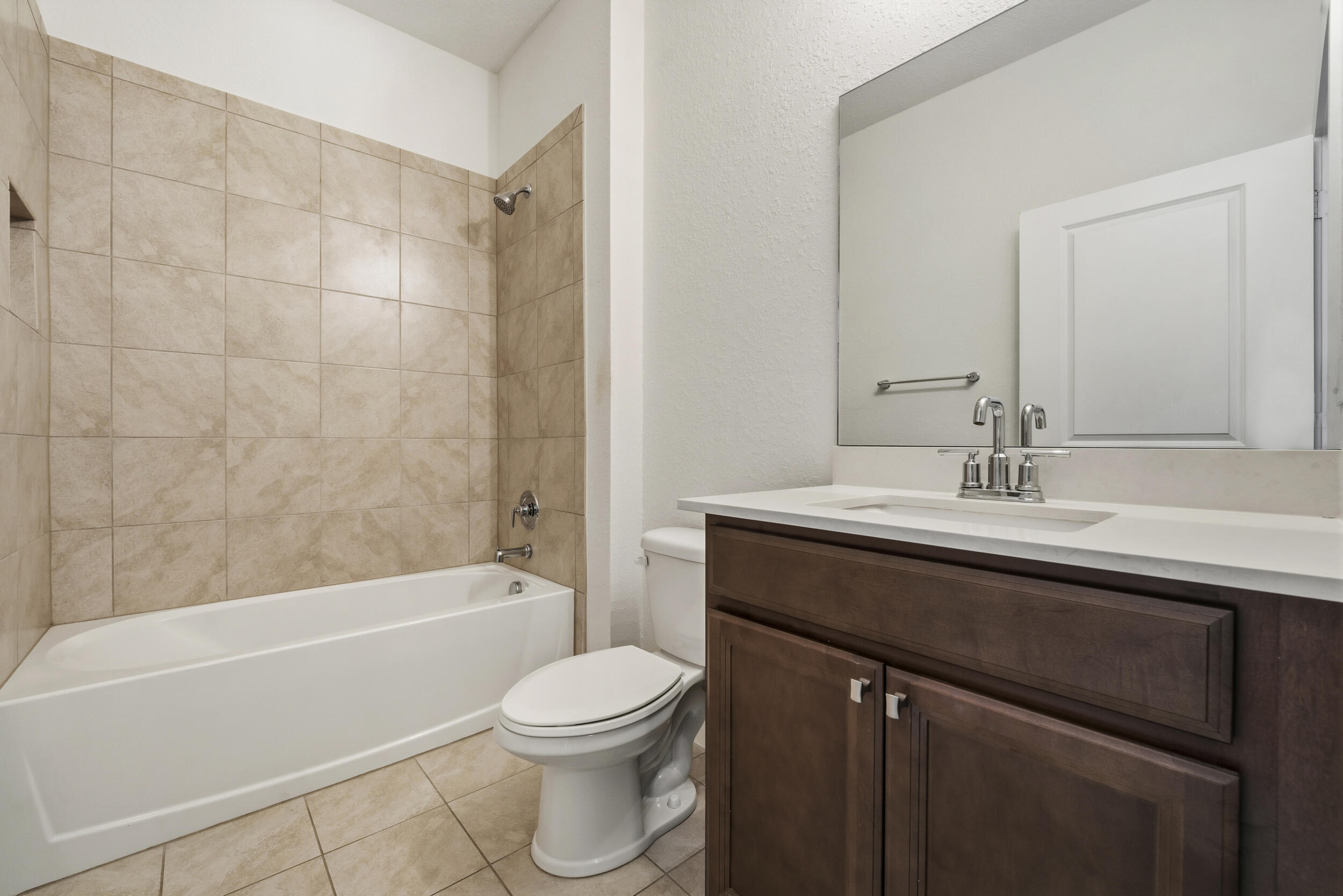 7461 Southwest Harbor Cove Drive Stuart, FL 34997 - Photo 15 of 30 a bathroom with a sink a toilet and shower