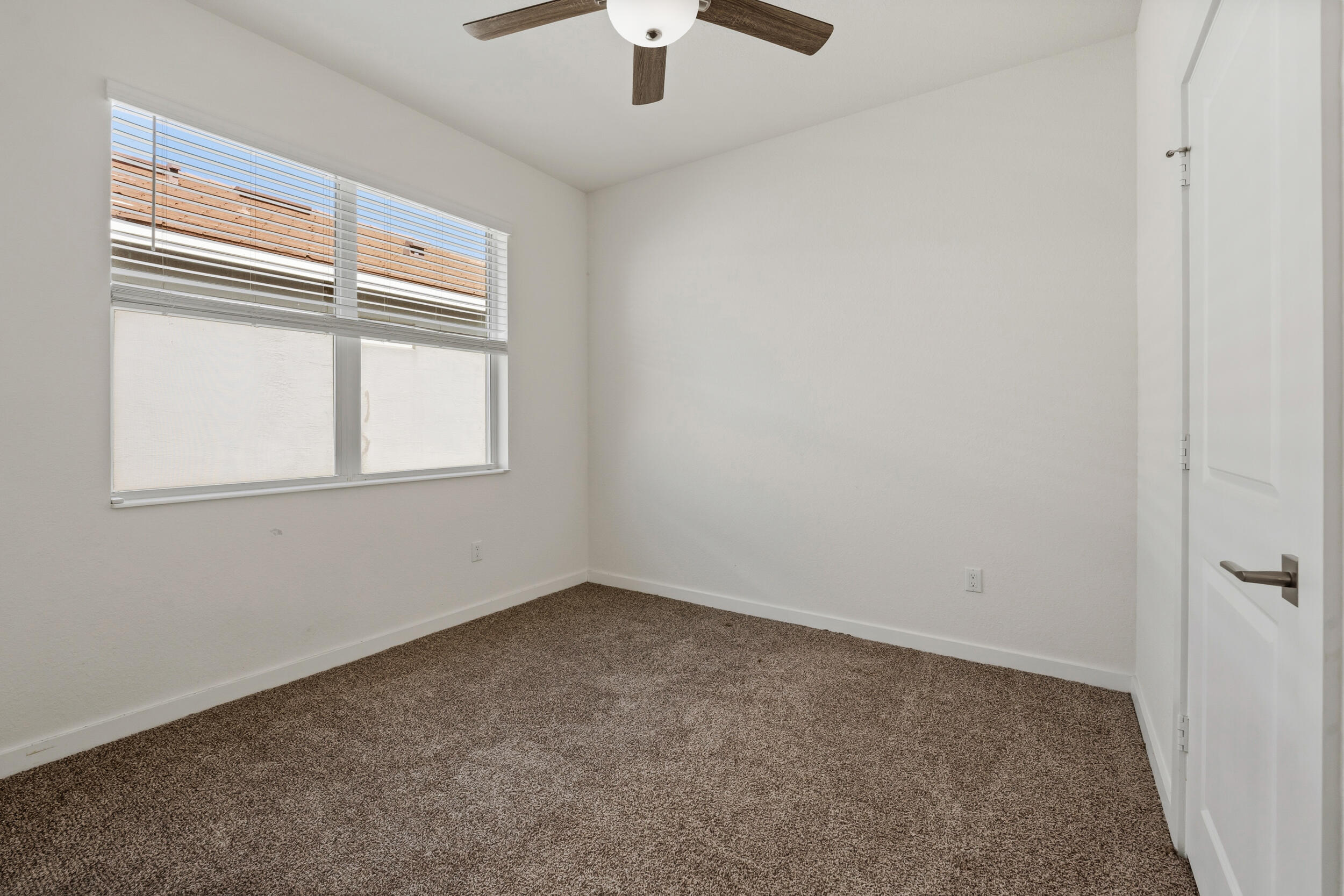 7461 Southwest Harbor Cove Drive Stuart, FL 34997 - Photo 16 of 30 an empty room with a window