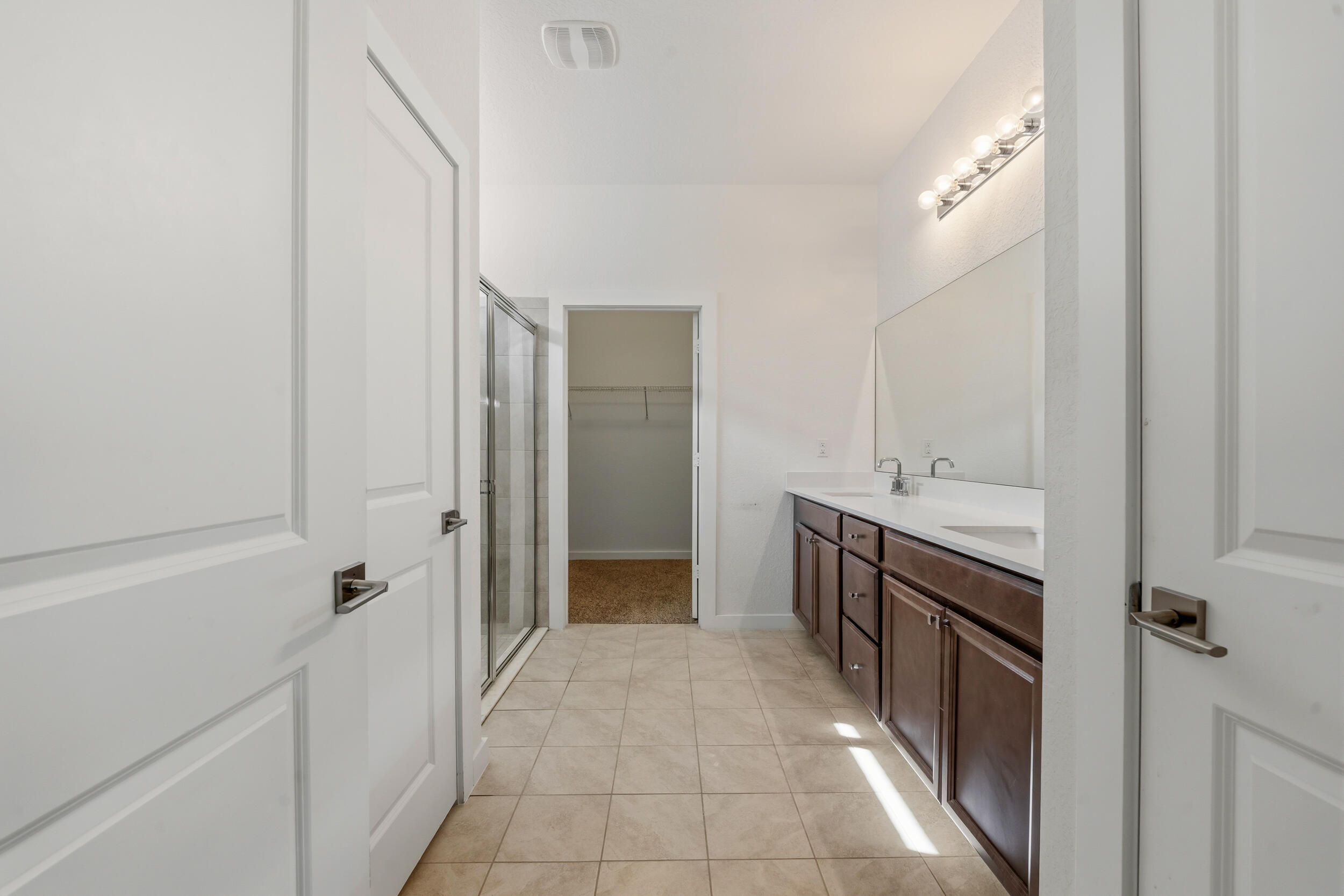 7461 Southwest Harbor Cove Drive Stuart, FL 34997 - Photo 19 of 30 a bathroom with a sink and mirror