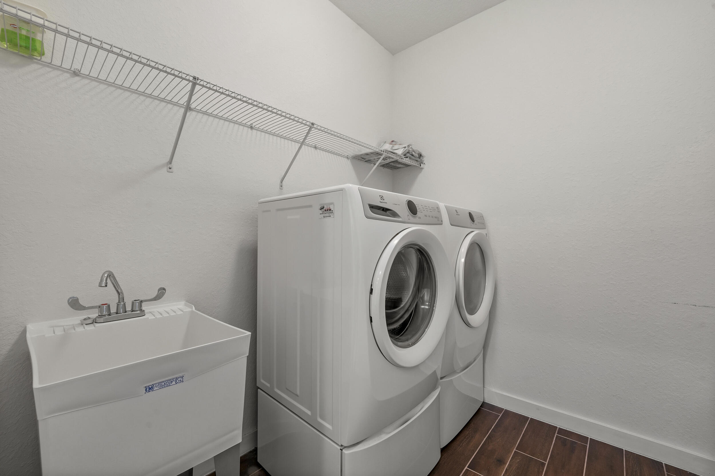7461 Southwest Harbor Cove Drive Stuart, FL 34997 - Photo 23 of 30 a utility room with dryer and washer