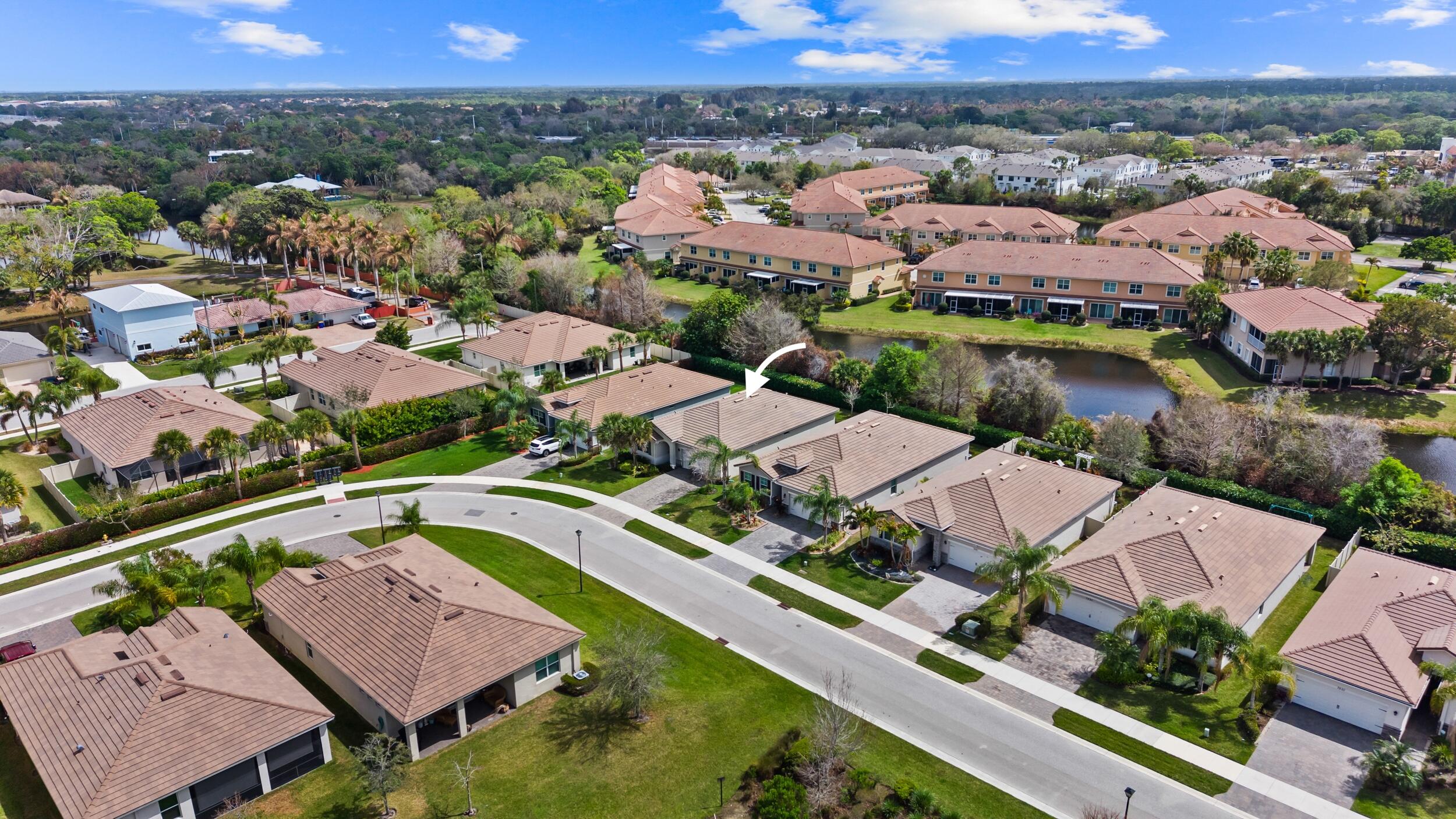 7461 Southwest Harbor Cove Drive Stuart, FL 34997 - Photo 5 of 30 an aerial view of residential houses with outdoor space