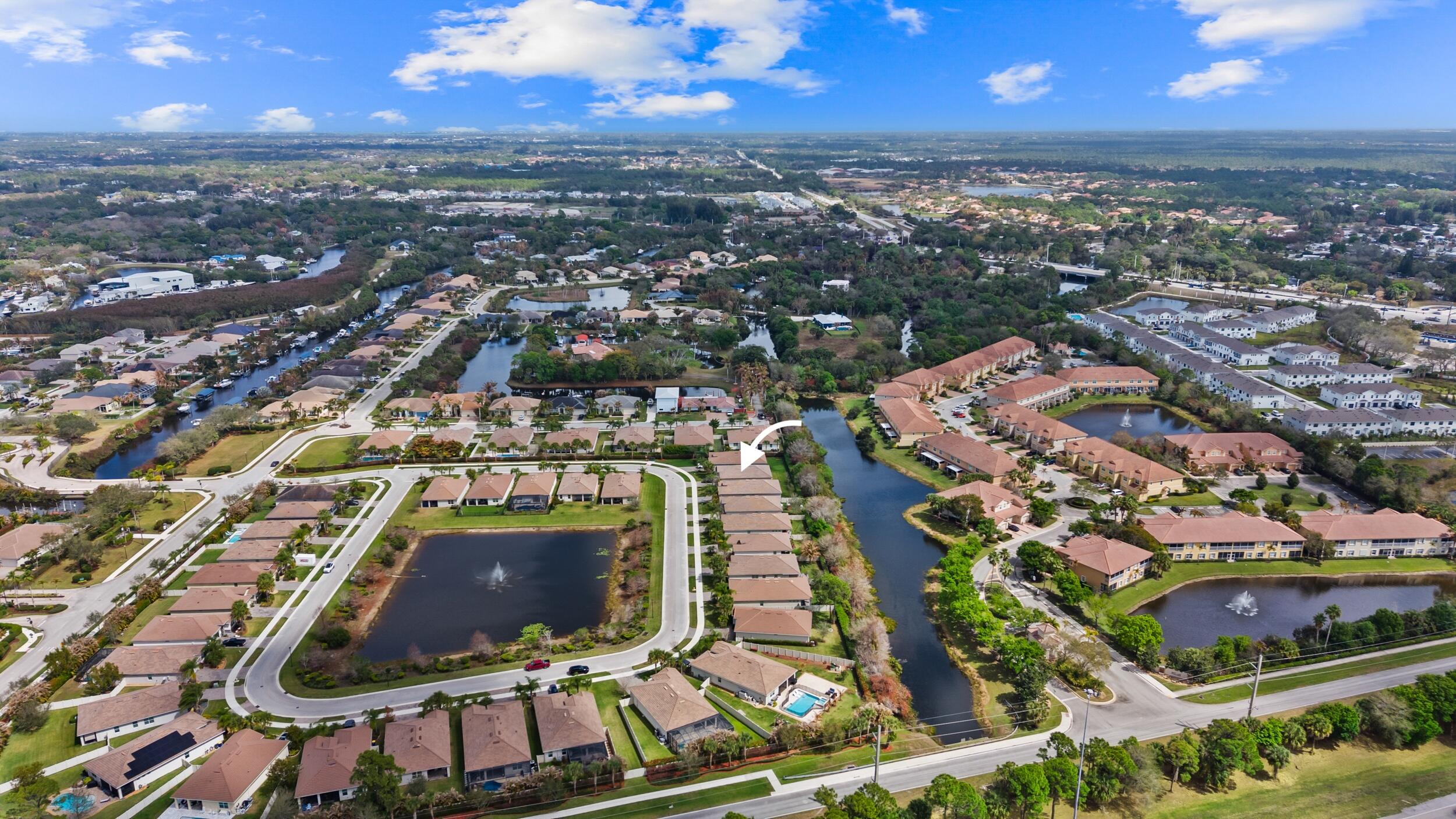 7461 Southwest Harbor Cove Drive Stuart, FL 34997 - Photo 6 of 30 an aerial view of residential houses with outdoor space