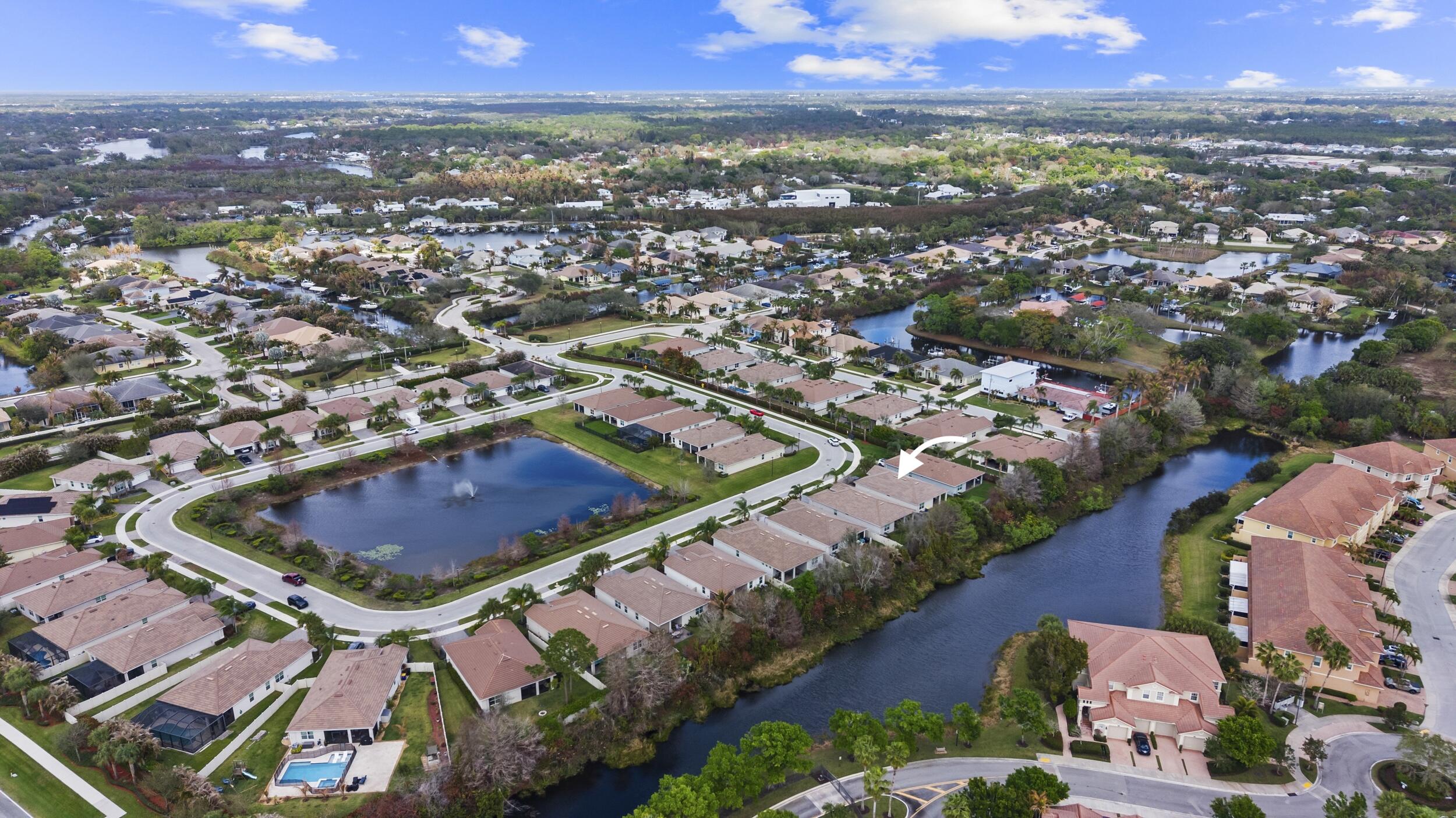7461 Southwest Harbor Cove Drive Stuart, FL 34997 - Photo 7 of 30 an aerial view of residential houses with outdoor space