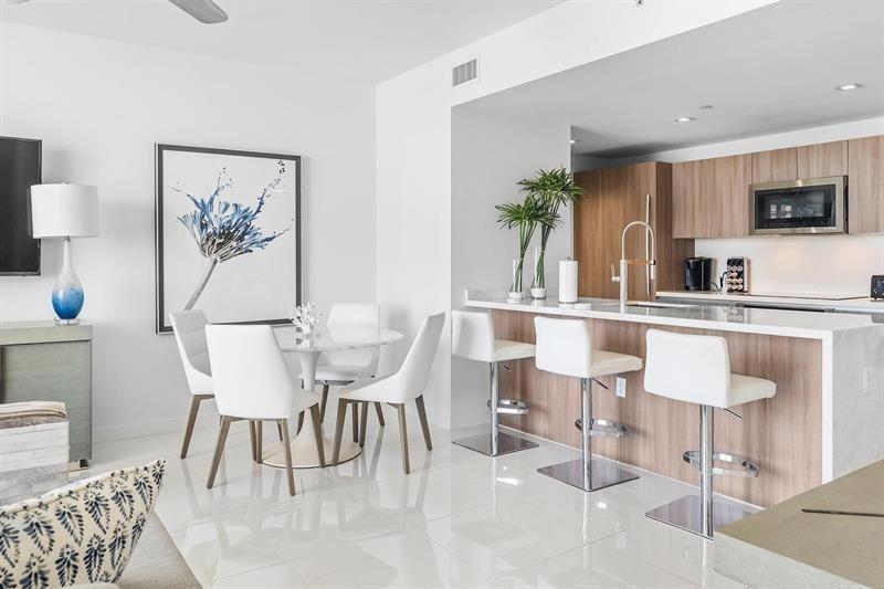401 North Birch Road, Unit 1214 Fort Lauderdale, FL 33304 - Photo 12 of 47 a dining room with furniture and window