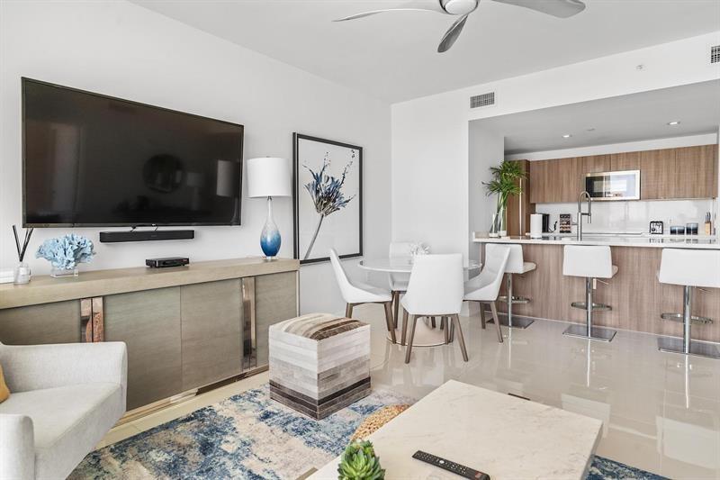 401 North Birch Road, Unit 1214 Fort Lauderdale, FL 33304 - Photo 15 of 47 a living room with furniture and a flat screen tv
