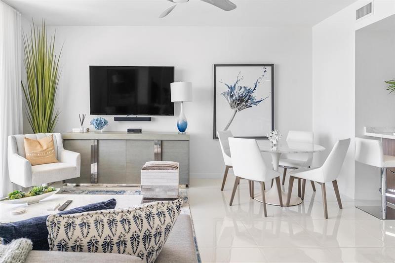 401 North Birch Road, Unit 1214 Fort Lauderdale, FL 33304 - Photo 16 of 47 a living room with furniture and a flat screen tv