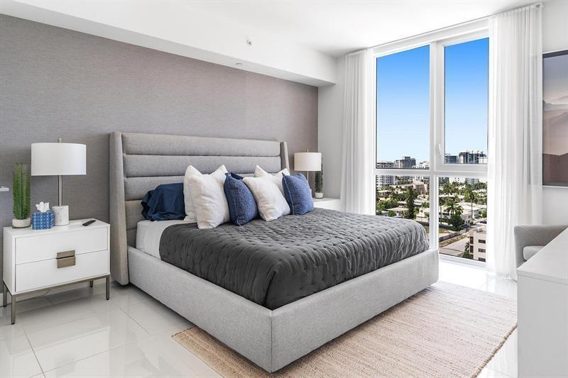 401 North Birch Road, Unit 1214 Fort Lauderdale, FL 33304 - Photo 18 of 47 a spacious bedroom with a bed and a window