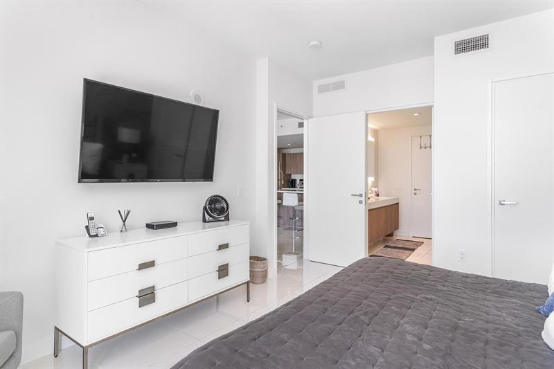 401 North Birch Road, Unit 1214 Fort Lauderdale, FL 33304 - Photo 20 of 47 a spacious bathroom with a double vanity sink and mirror