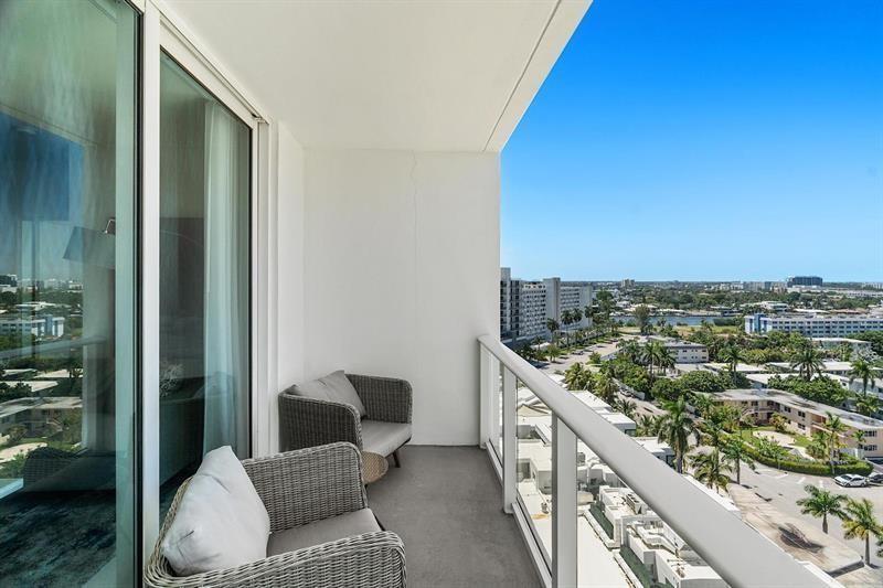 401 North Birch Road, Unit 1214 Fort Lauderdale, FL 33304 - Photo 27 of 47 a balcony with table and chairs