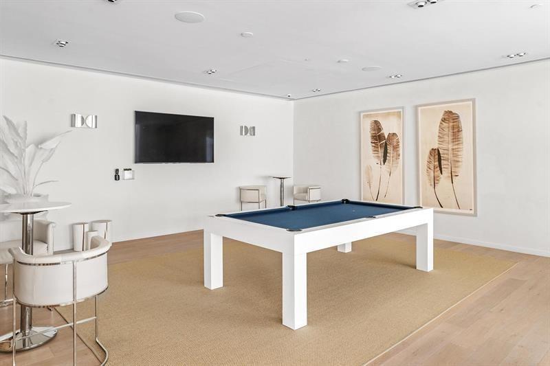 401 North Birch Road, Unit 1214 Fort Lauderdale, FL 33304 - Photo 34 of 47 a living room with furniture and a flat screen tv