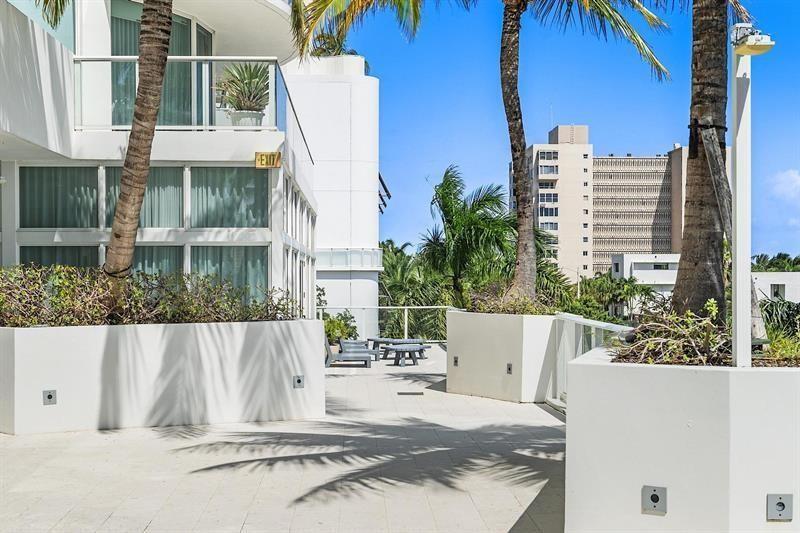 401 North Birch Road, Unit 1214 Fort Lauderdale, FL 33304 - Photo 40 of 47 front view of a house with a small yard
