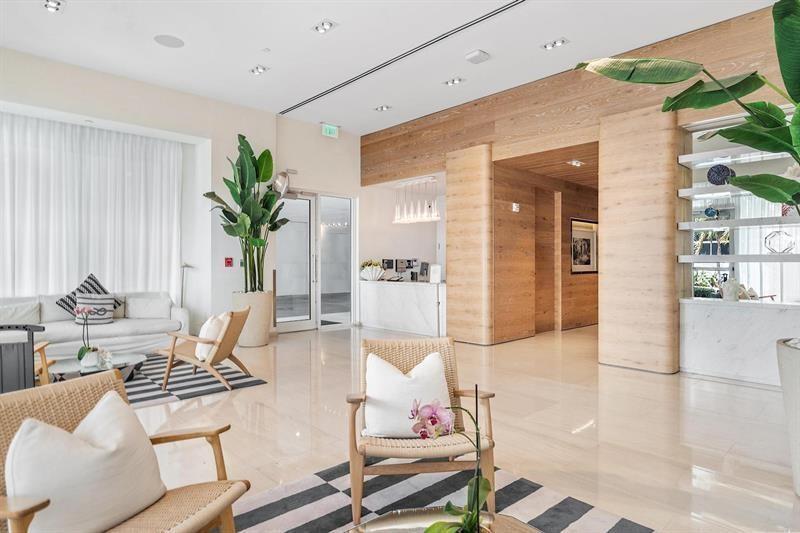 401 North Birch Road, Unit 1214 Fort Lauderdale, FL 33304 - Photo 4 of 47 a living room with furniture and a potted plant