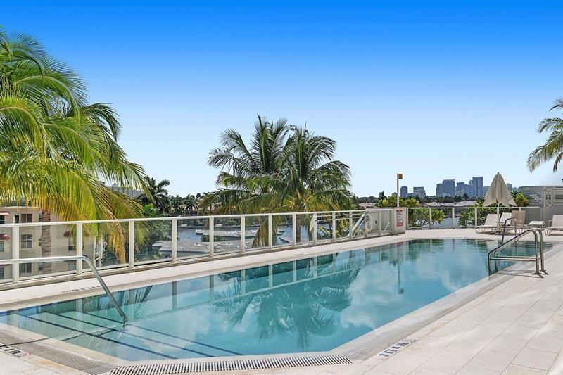 401 North Birch Road, Unit 1214 Fort Lauderdale, FL 33304 - Photo 43 of 47 a view of a swimming pool with a lake view