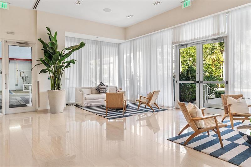 401 North Birch Road, Unit 1214 Fort Lauderdale, FL 33304 - Photo 5 of 47 a living room with patio furniture