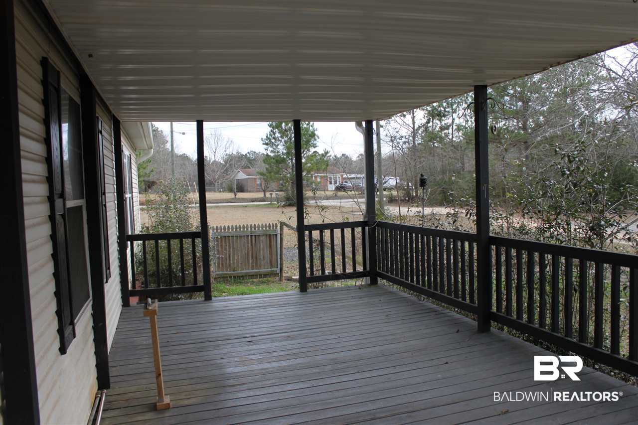 9380 Spice Pond Road Eight Mile, AL 36613 - Photo 3 of 36 Spacious covered porch overlooking fenced area.