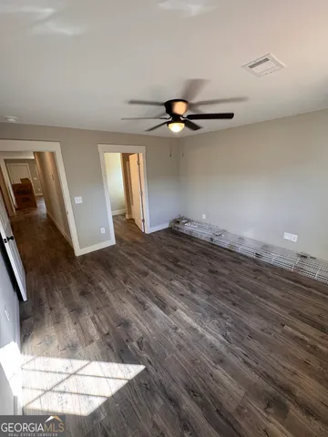 a view of a livingroom with wooden floor