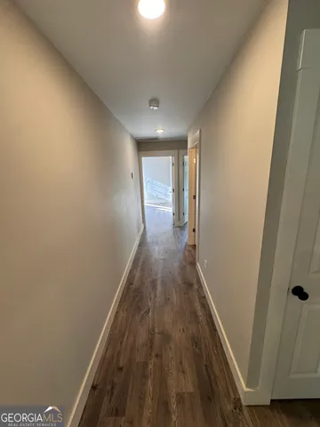 a view of gallery with wooden floor