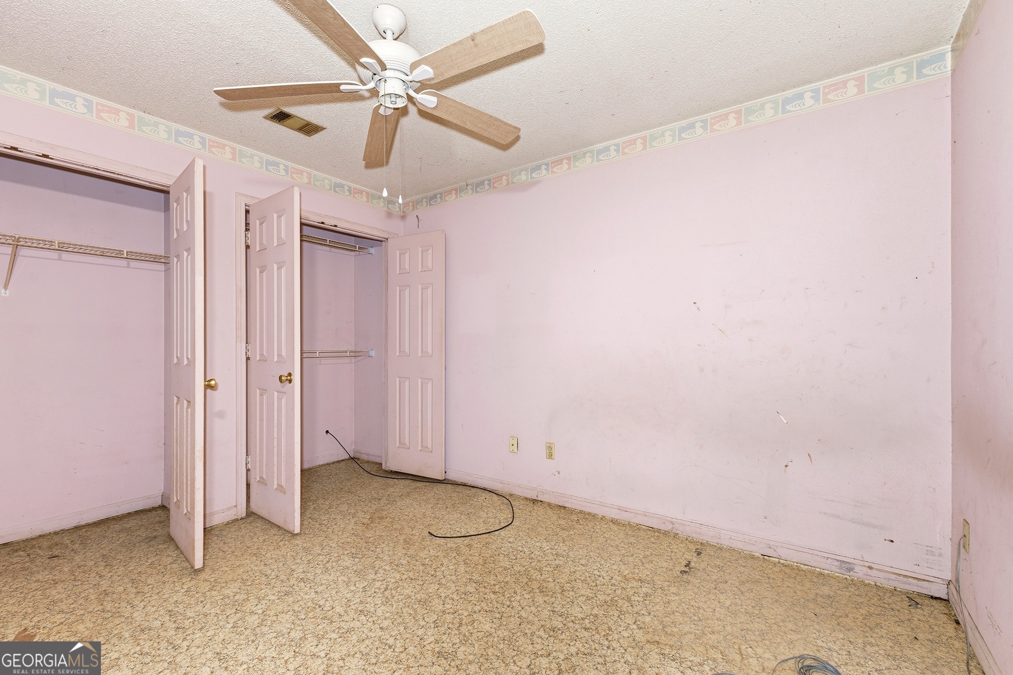 342 North Lake Drive Perry, GA 31069 - Photo 17 of 22 an empty room with a ceiling fan and carpet