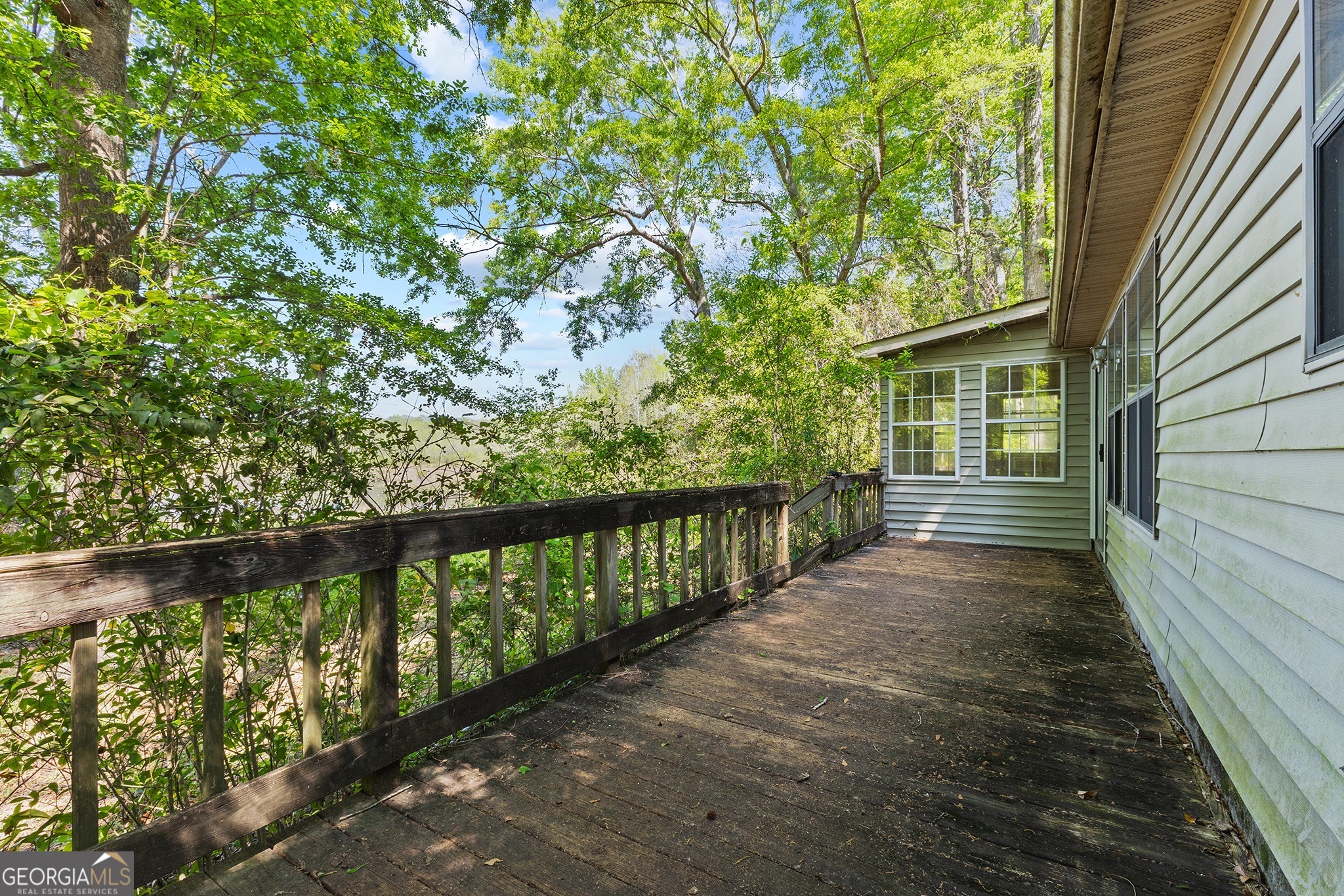 342 North Lake Drive Perry, GA 31069 - Photo 8 of 22 a view of a balcony with wooden fence