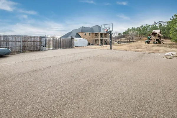 a view of a house with a yard and garage