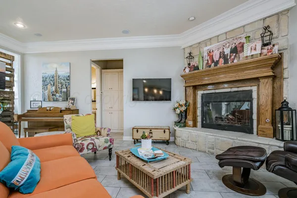a living room with furniture ceiling fan and a rug