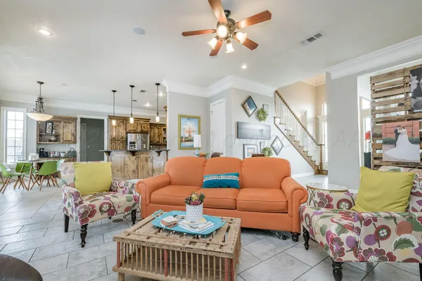 a living room with furniture a couch and a fireplace