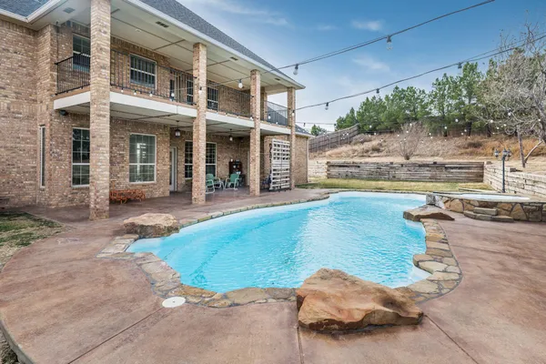 a view of a house with swimming pool