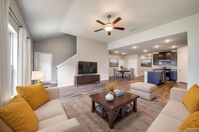 a view of a kitchen with a sink and a window