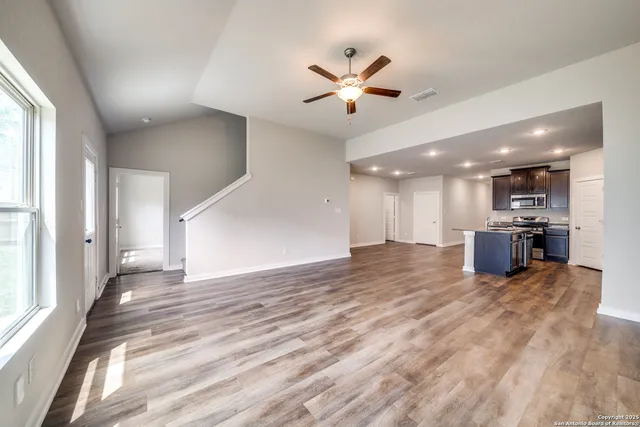 a view of a kitchen with a sink and a window