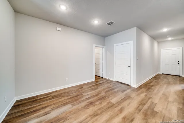 a view of a kitchen with microwave and cabinets