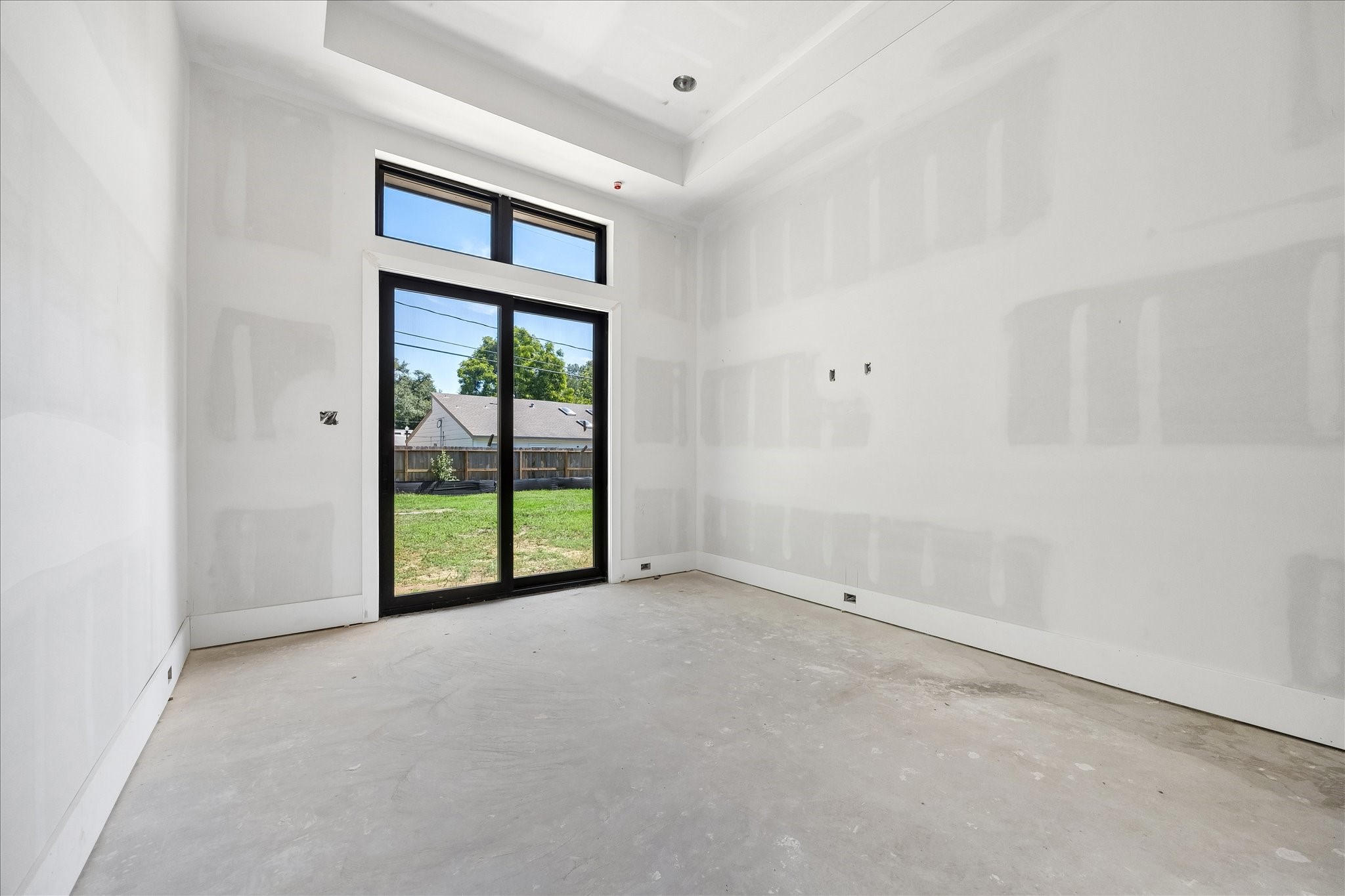 9050 Elizabeth Road Houston, TX 77055 - Photo 16 of 40 a view of an empty room with a window